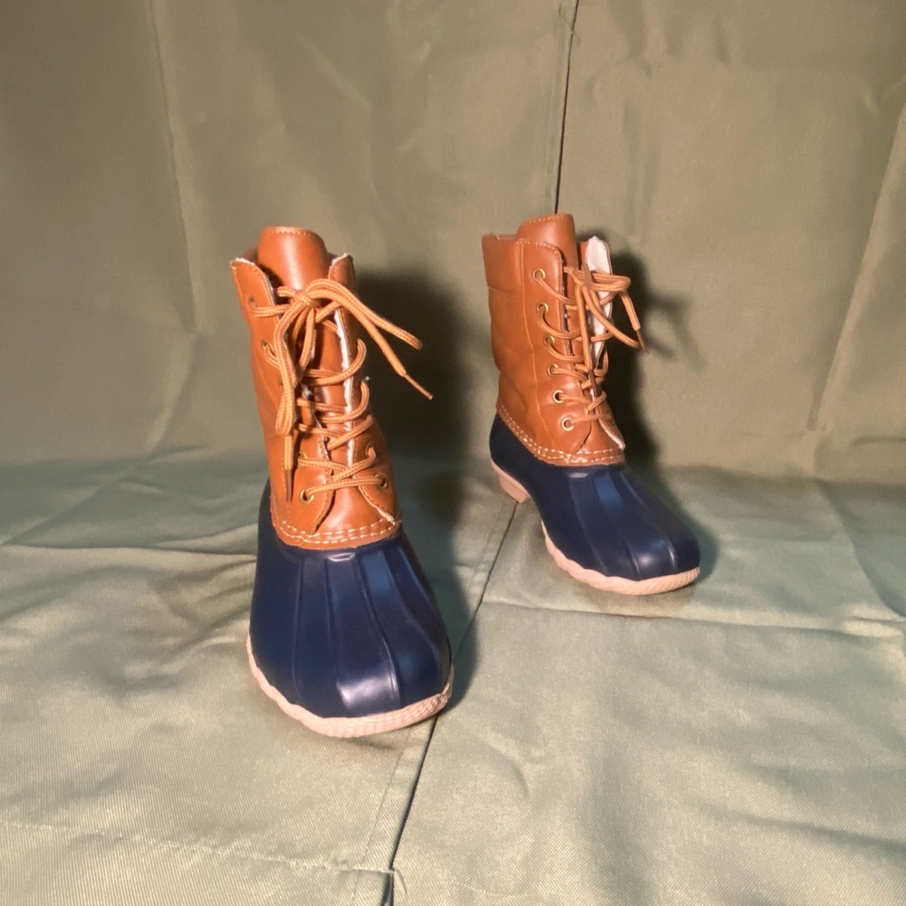 Brown and navy fur lined duck boots